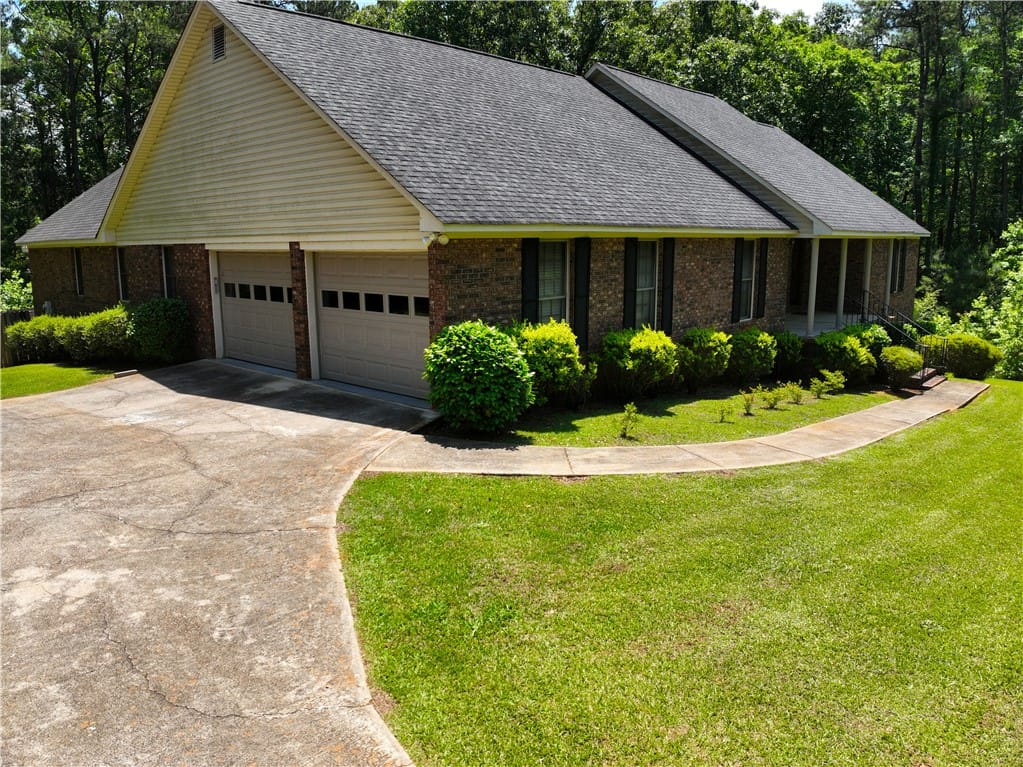 1016 Co Rd 515, Lanett, AL 36863, A classic brick exterior, inviting with its integr
