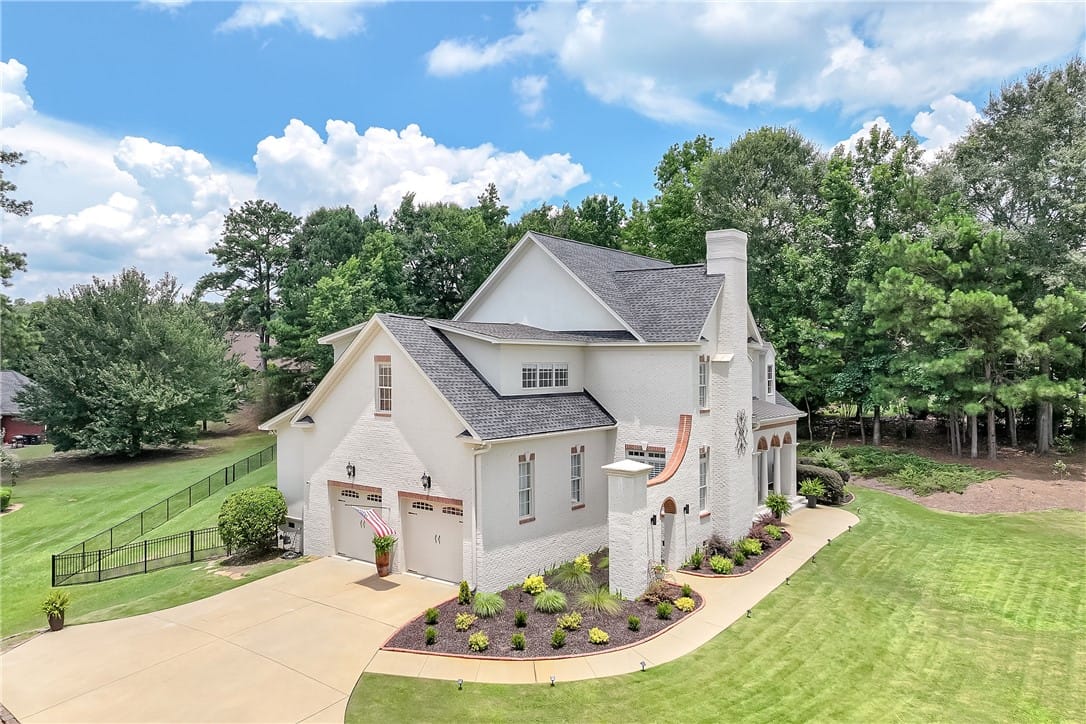 3308 Stonybrook Pl, Opelika, AL 36804, White brick residence with a neatly manicured land
