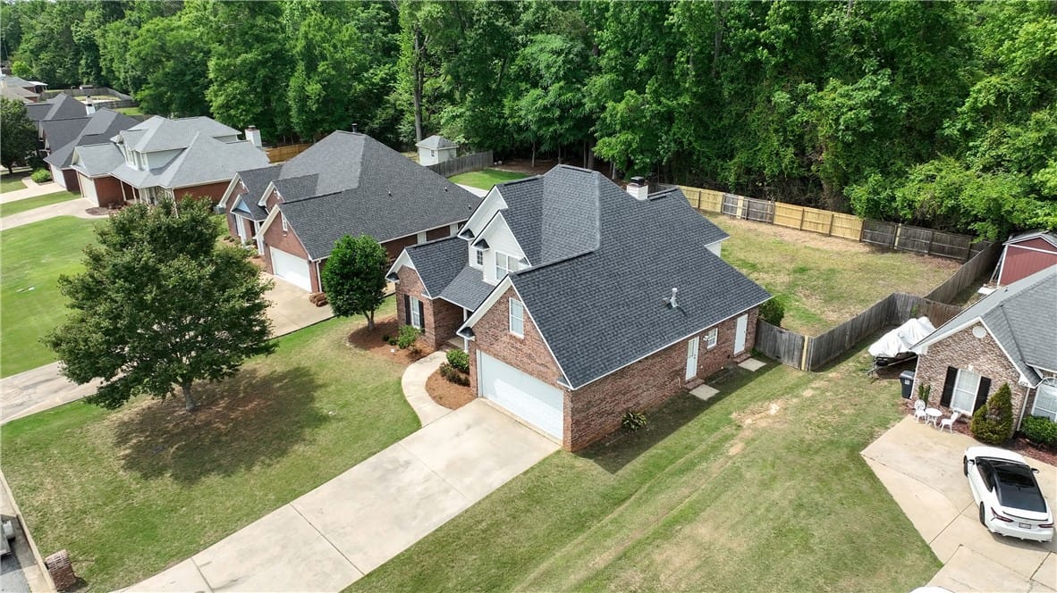 611 Shadow Wood Dr, Smiths Station, AL 36877, An aerial view showcases a residential neighborhoo