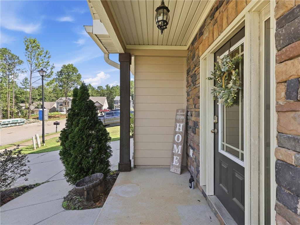 394 Lightness Dr, Auburn, AL 36832, A welcoming front porch features elegant stone sid