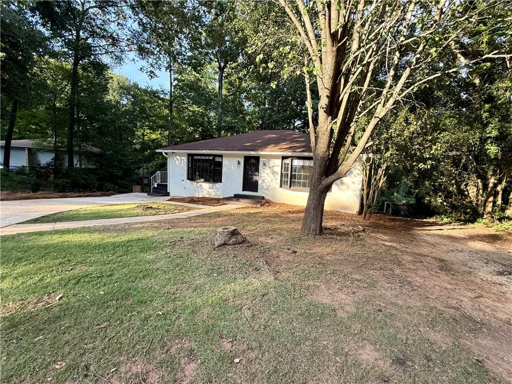 752 Letohatchee St, Auburn, AL 36830, A classic ranch home nestled among mature trees of