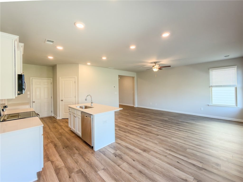 2553 Arlee Ave, Opelika, AL 36804, Rich wood-look flooring anchors this open living s
