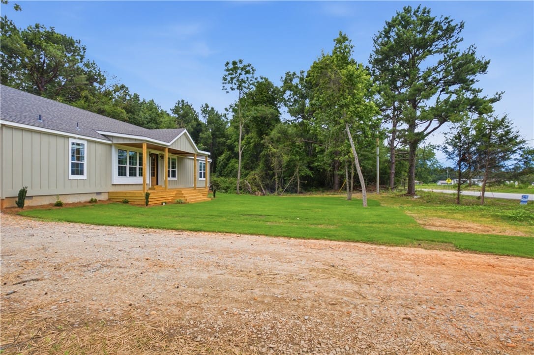 21877 Stillwaters Hwy, Tallassee, AL 36078, A welcoming front porch extends across the facade