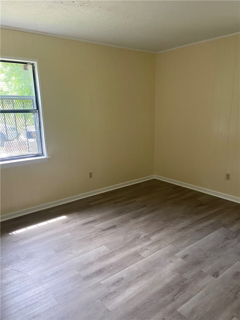 1412 Gautier St, Tuskegee, AL 36083, Well-lit room with durable wood-look flooring and