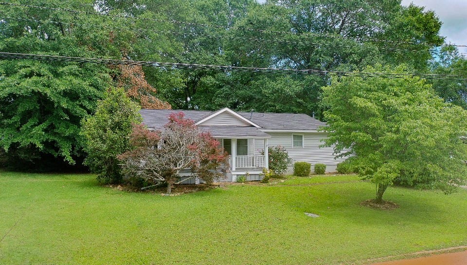 711 Herndon St, Opelika, AL 36801, A well-maintained facade with a welcoming porch of
