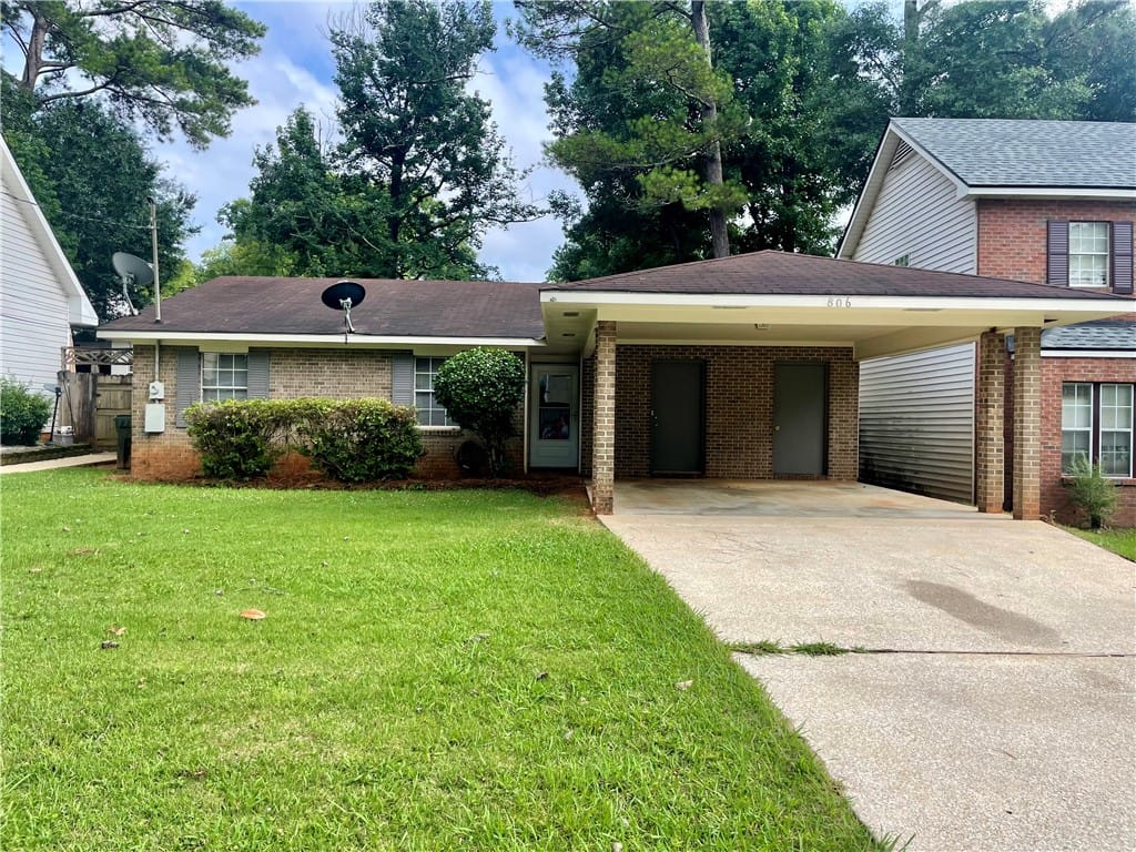 806 Choctaw Ave, Auburn, AL 36830, A classic brick facade welcomes you to this charmi