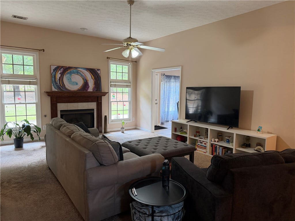 619 BELMONTE, Auburn, AL, 36830, This inviting living room features a cozy fireplac