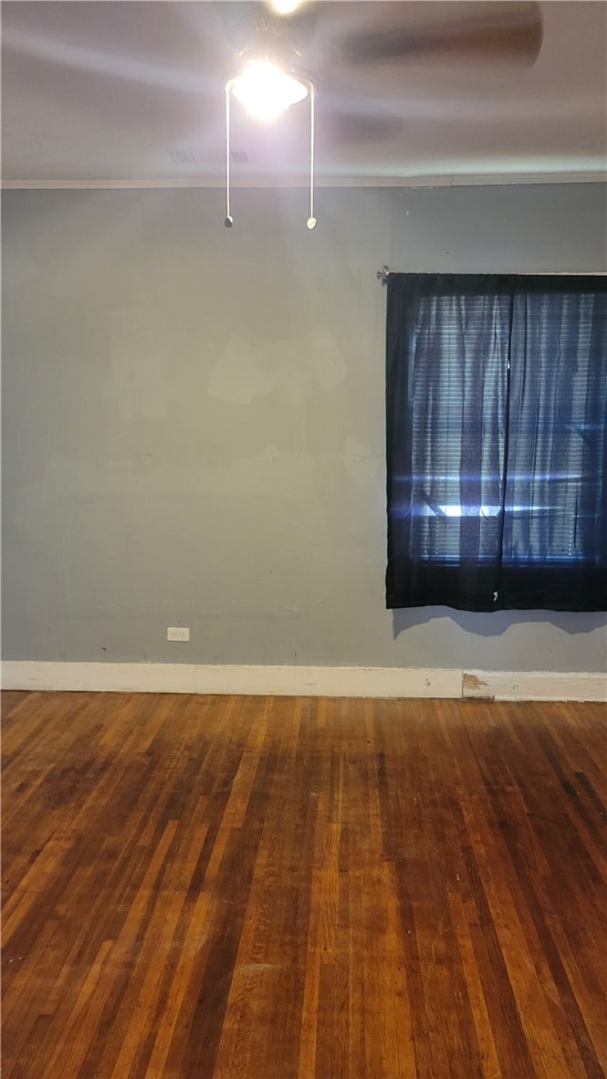 408 Brewer St, Tuskegee, AL 36083, Classic hardwood floors anchor this bedroom ready