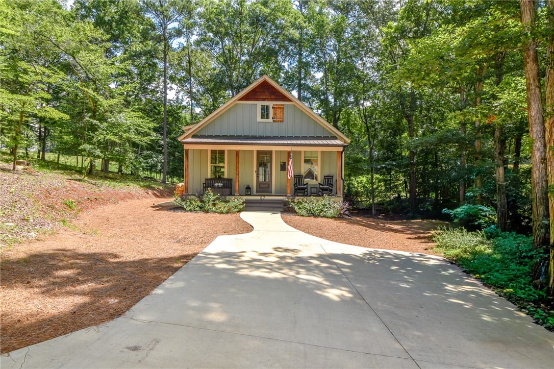 87 River Birch Trl, Dadeville, AL 36853, A charming home nestled amongst dense trees, featu