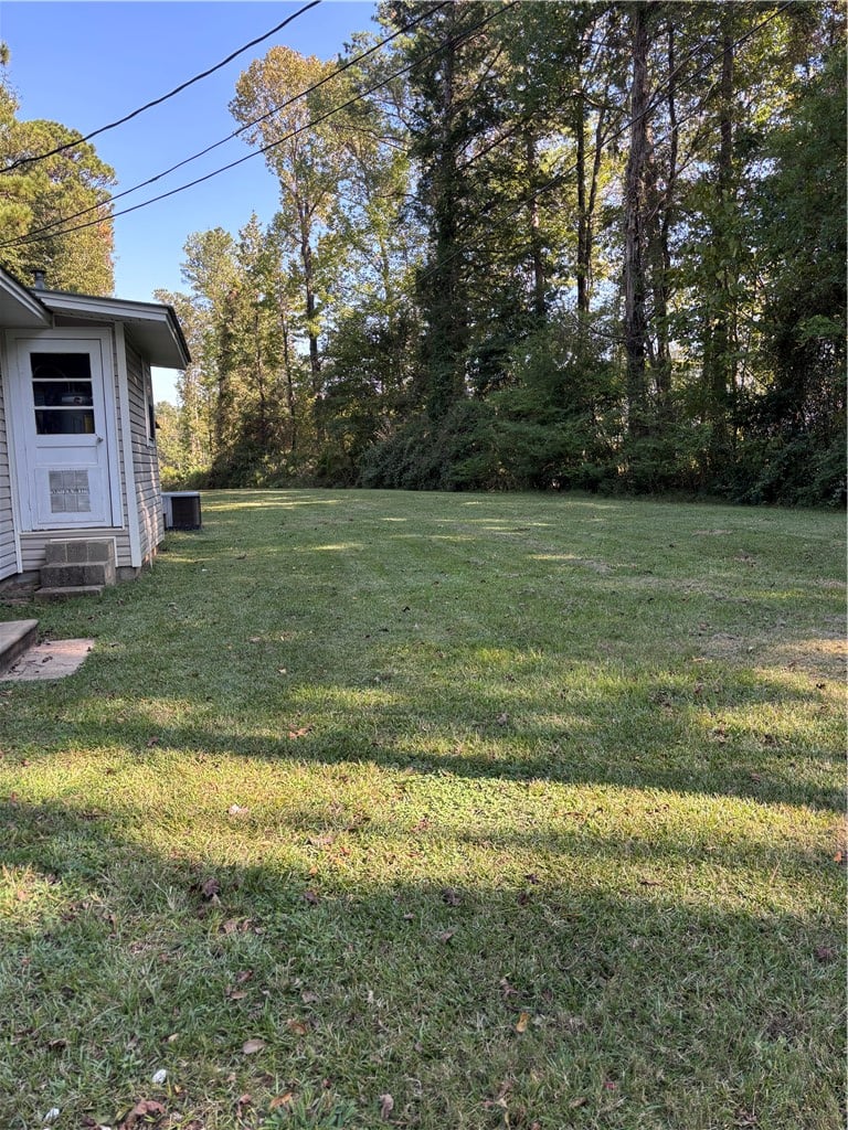 1813 Old Columbus Rd, Opelika, AL 36804, Mature trees frame a grassy lawn offering outdoor