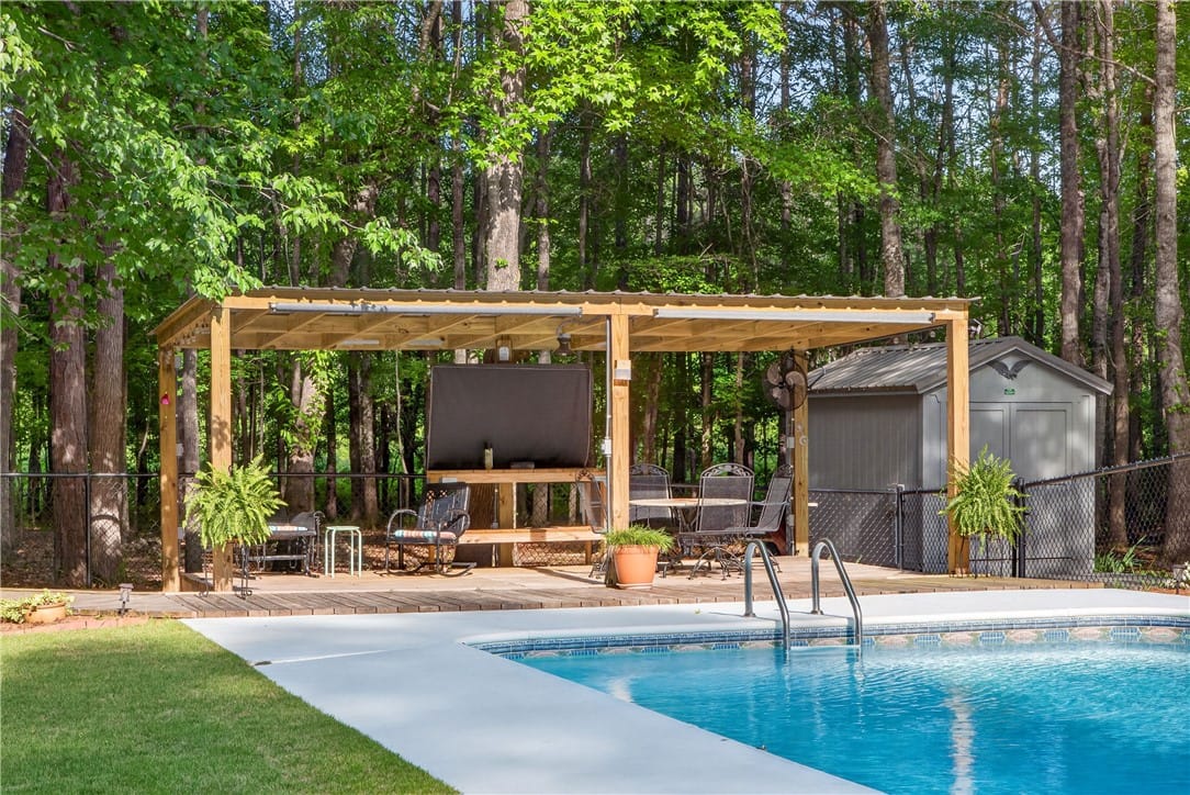 655 Lee Road 735 #737, Opelika, AL 36804, A private backyard oasis features a shimmering poo