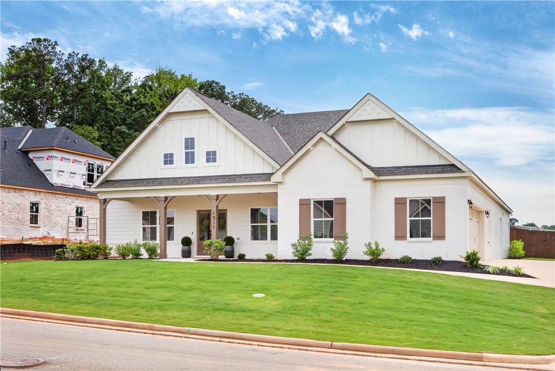 1311 Hidden Lks Dr, Opelika, AL 36801, A striking home and an inviting covered entry, poi