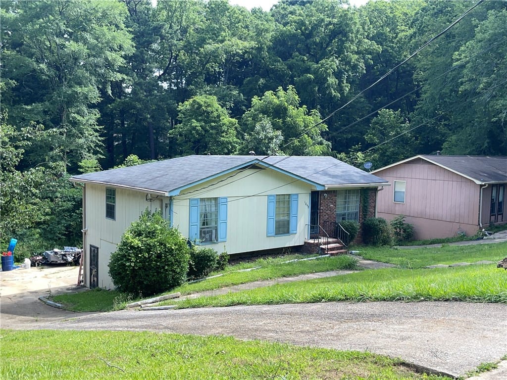 1648 Azalea Dr, Birmingham, AL 35235, A charming residence with a driveway leads to a ho