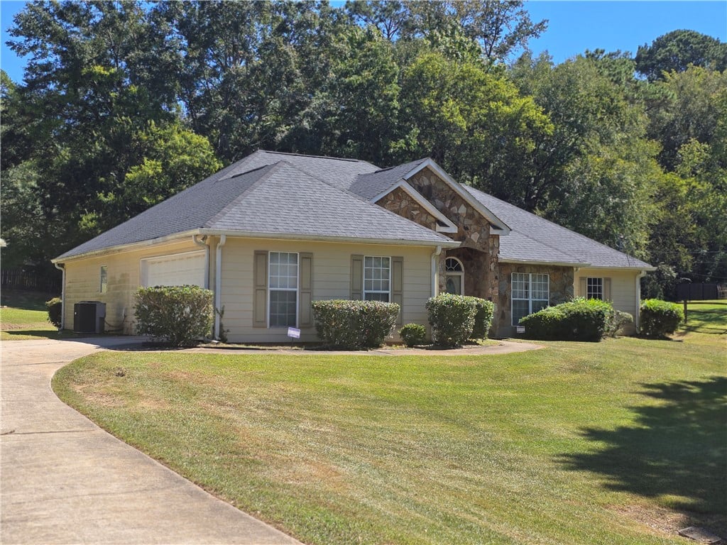 2604 18th Pl, Valley, AL 36854, Mature trees frame a classic stone and siding exte
