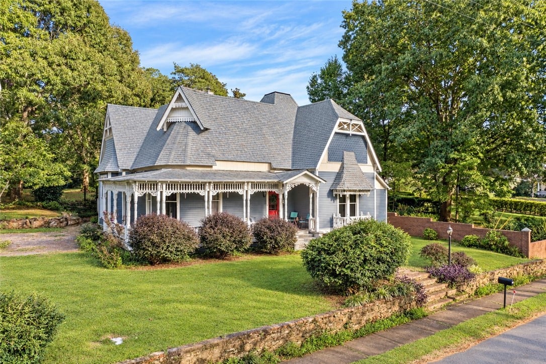 236 East St, Dadeville, AL 36853, A wrap-around porch and classic gables highlight t
