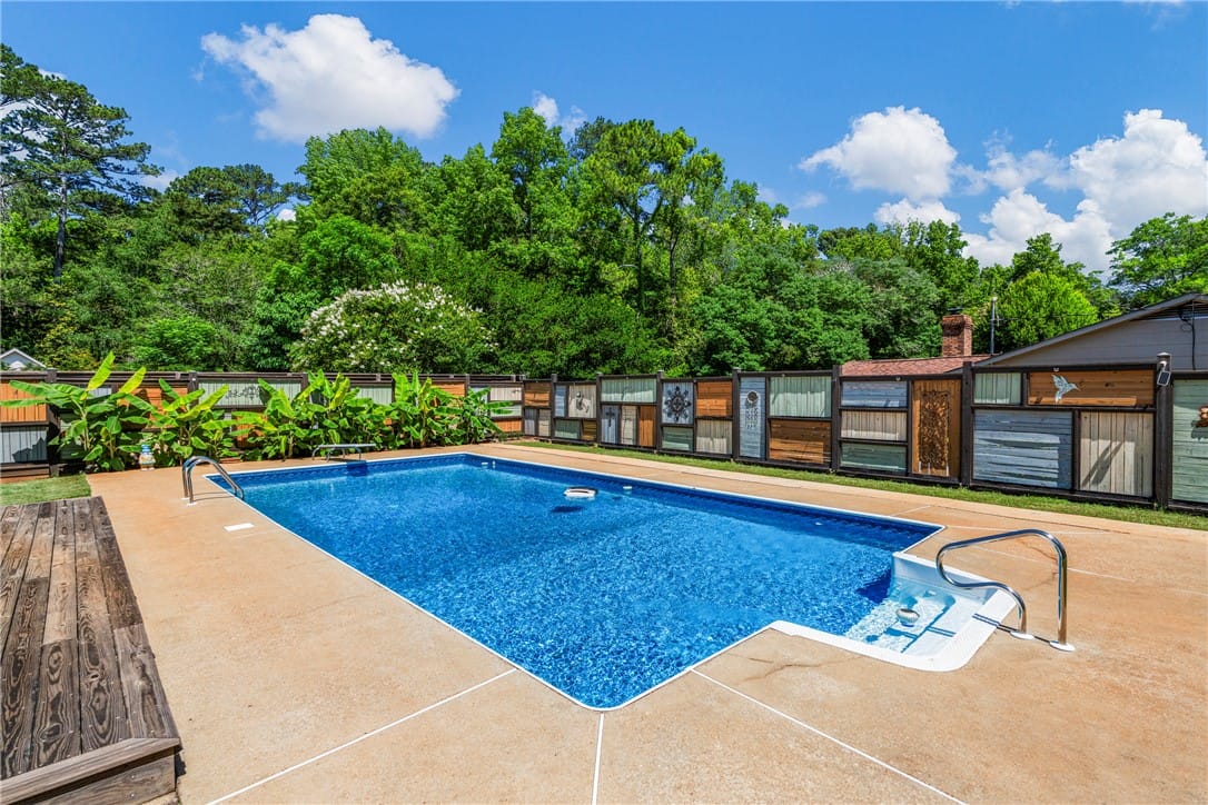 300 S Cedarbrook Dr, Auburn, AL 36830, A spacious in-ground pool offers a refreshing oasi