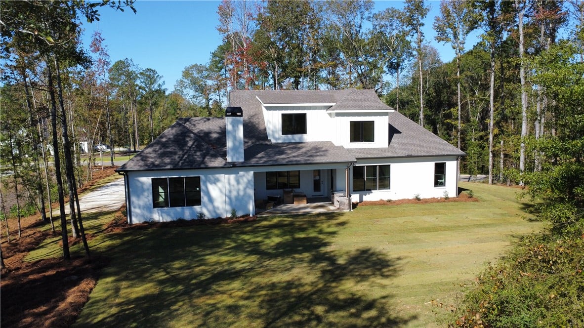 3213 Habersham Dr, Auburn, AL 36830, Mature trees frame a manicured lawn behind this mo