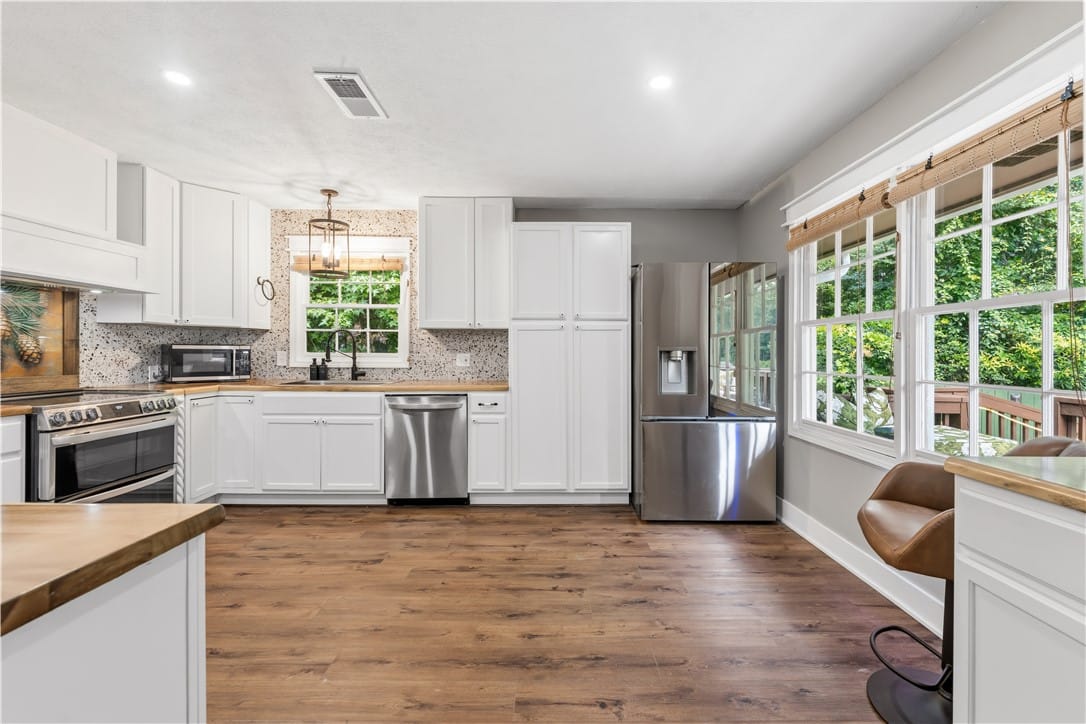 514 N Cedarbrook Dr, Auburn, AL 36830, A contemporary kitchen features bright white cabin