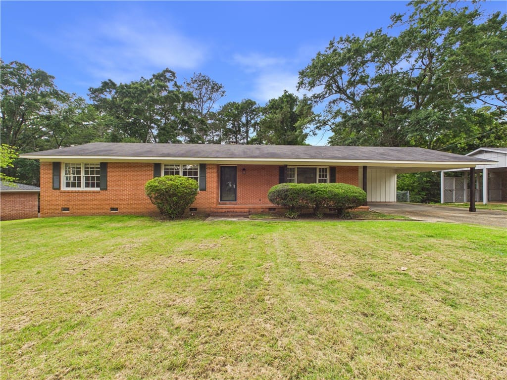 1300 Pinedale Dr, Opelika, AL 36801, USA, Brick facade home featuring a convenient carport a