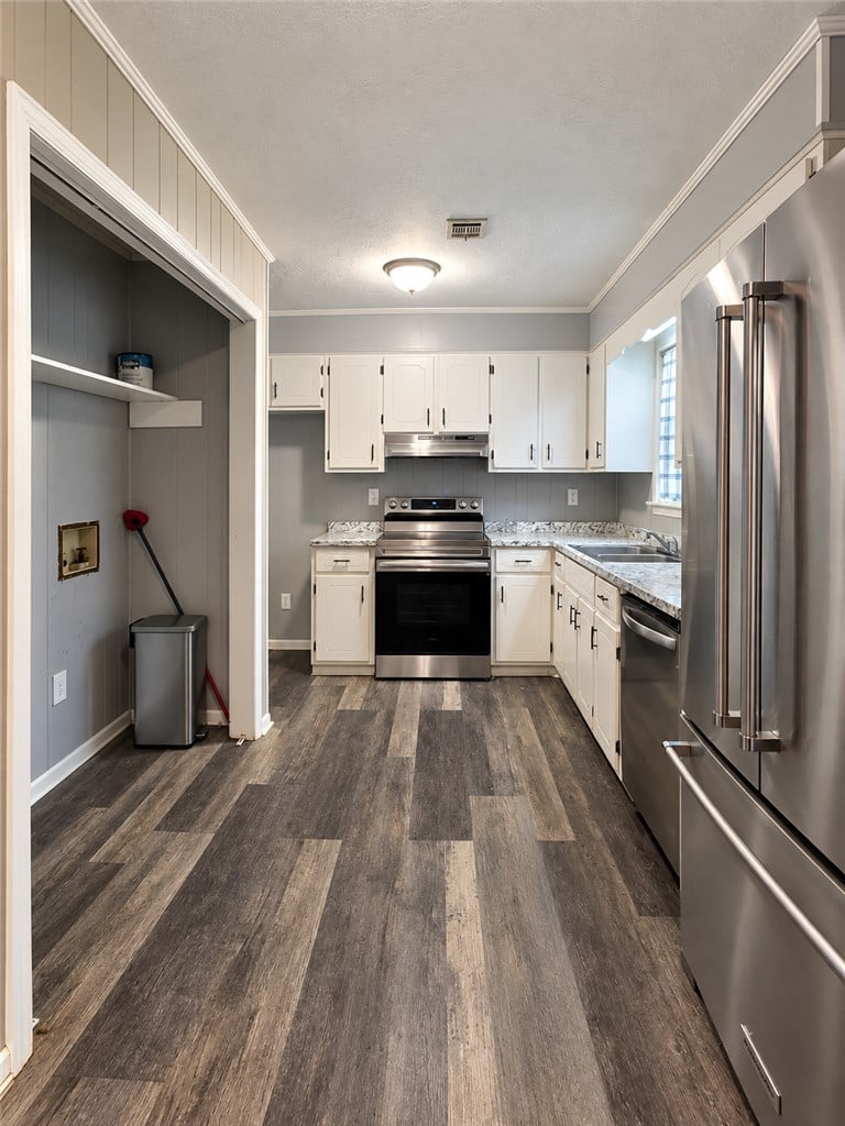 396 Herren St, Dadeville, AL 36853, USA, Gleaming wood-look flooring anchors this modern ki