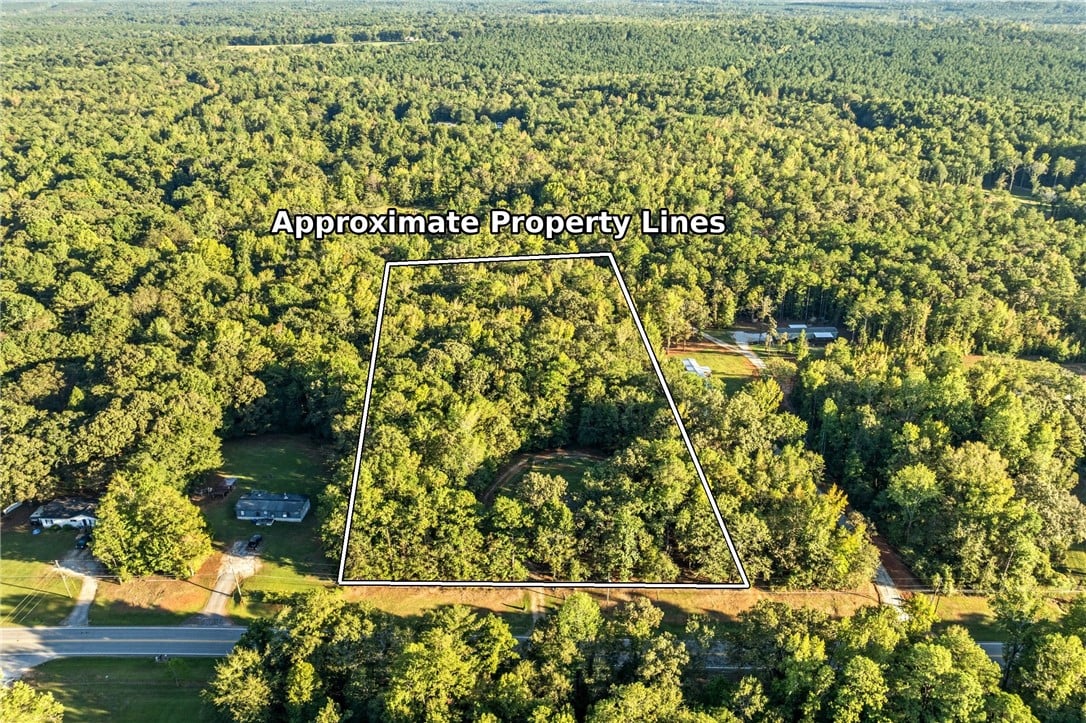 6601 US-29, Opelika, AL 36804, Lush mature trees surround this generous acreage o
