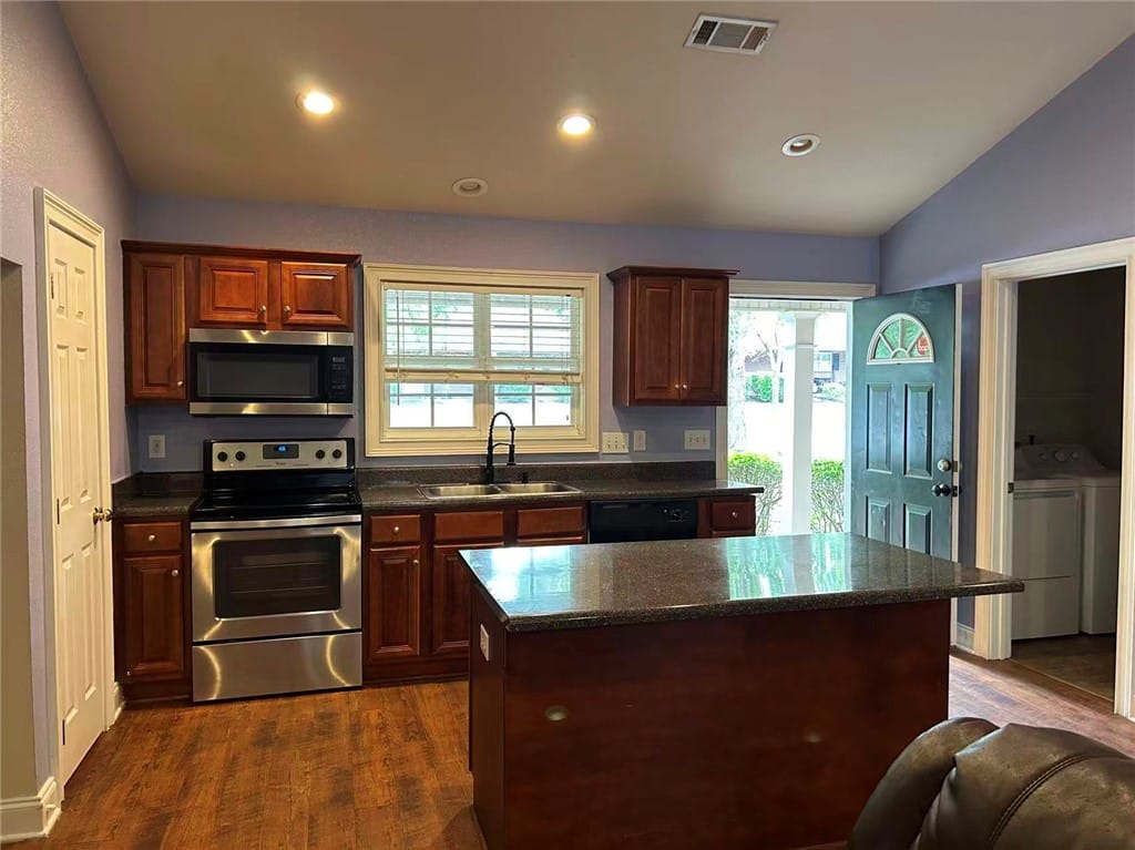 802 W Longleaf Dr Unit 53, Auburn, AL 36832, A well-appointed kitchen features rich wood cabine