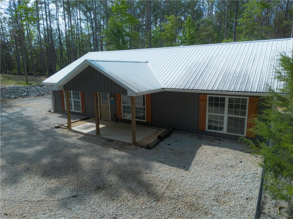 660 CRYSTAL, Wedowee, AL, 36278, An inviting gravel driveway leads to this charming