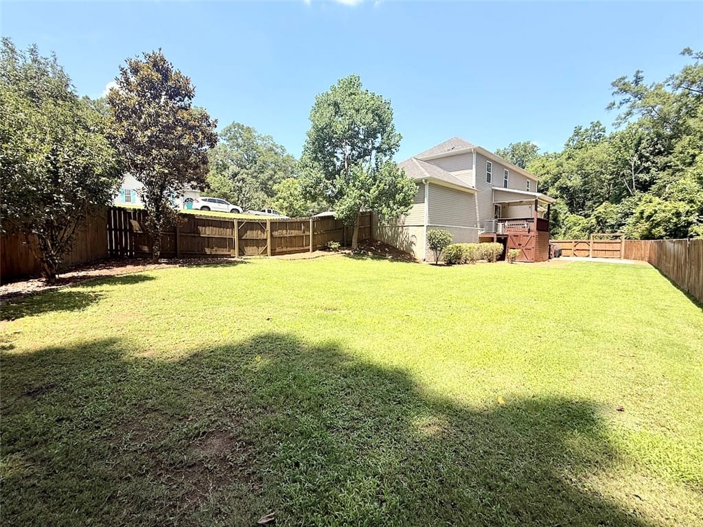 4317 Live Oak Dr, Auburn, AL 36830, A spacious, enclosed backyard offers ample green s