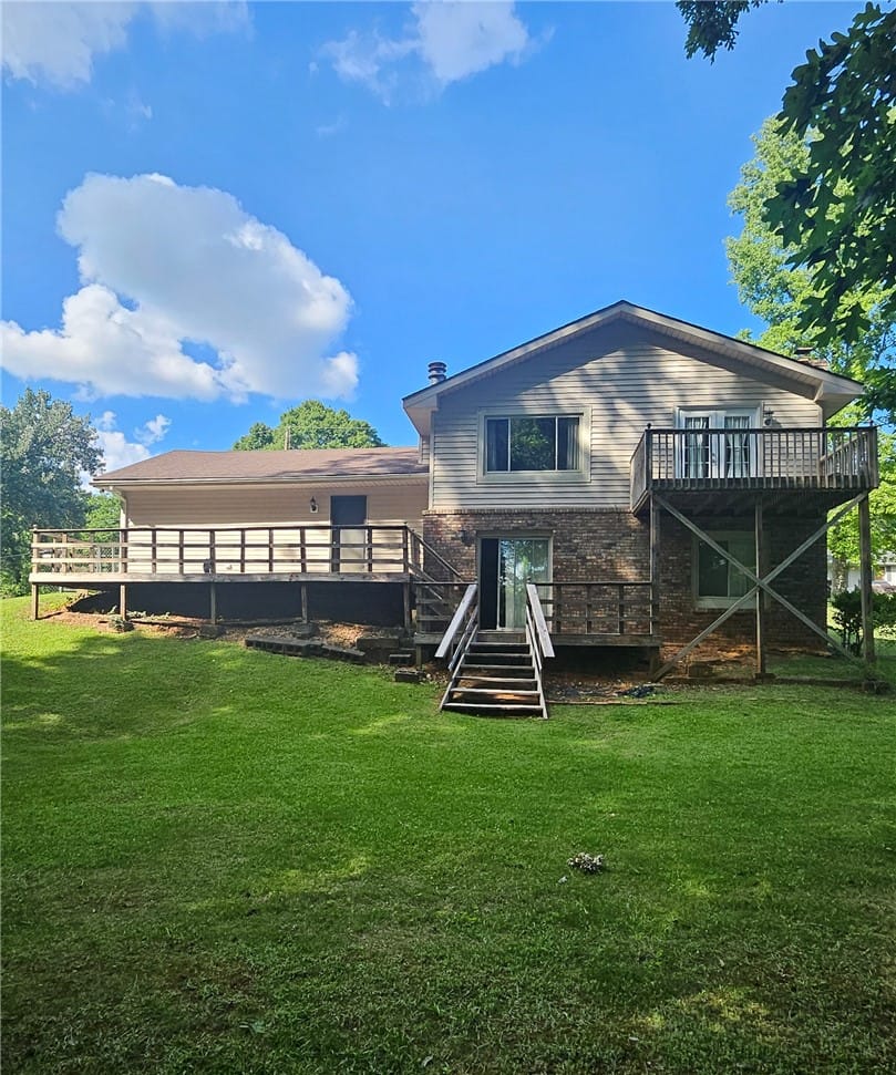 407 Watkins Ave, Opelika, AL 36804, A spacious backyard with multiple elevated decks o