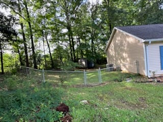 1909 26th St, Valley, AL 36854, USA, A private, fenced backyard offers a tranquil escap