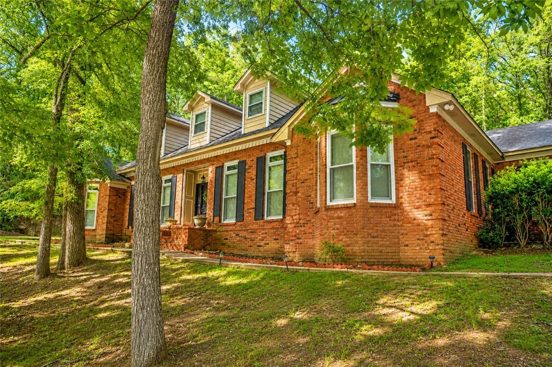 280 Willow Bend Dr, Wetumpka, AL 35010, A classic brick exterior, framed by mature trees,