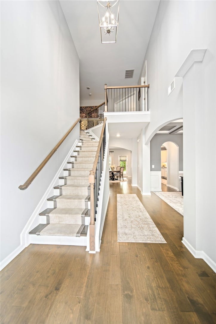 815 Wyndham Vlg Ct, Opelika, AL 36804, A soaring foyer welcomes guests with gleaming hard