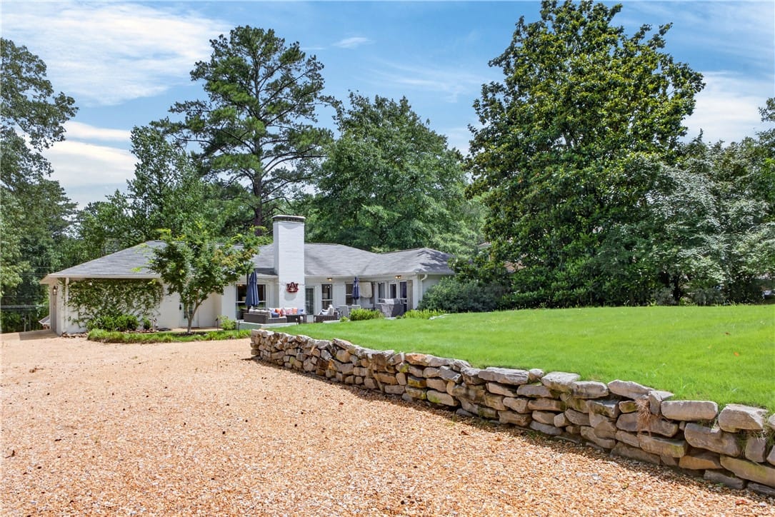 819 E University Dr, Auburn, AL 36830, USA, A graceful home sits back from a gravel driveway,