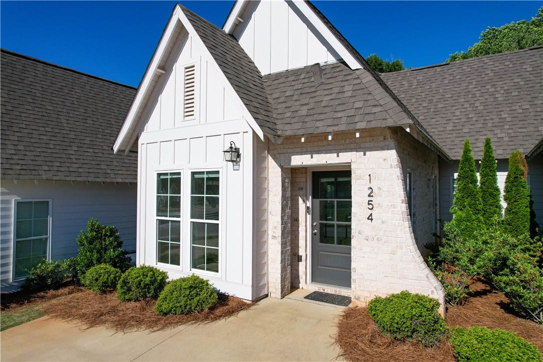 1254 Burrow Cir, Opelika, AL 36801, This charming home offers a welcoming facade with