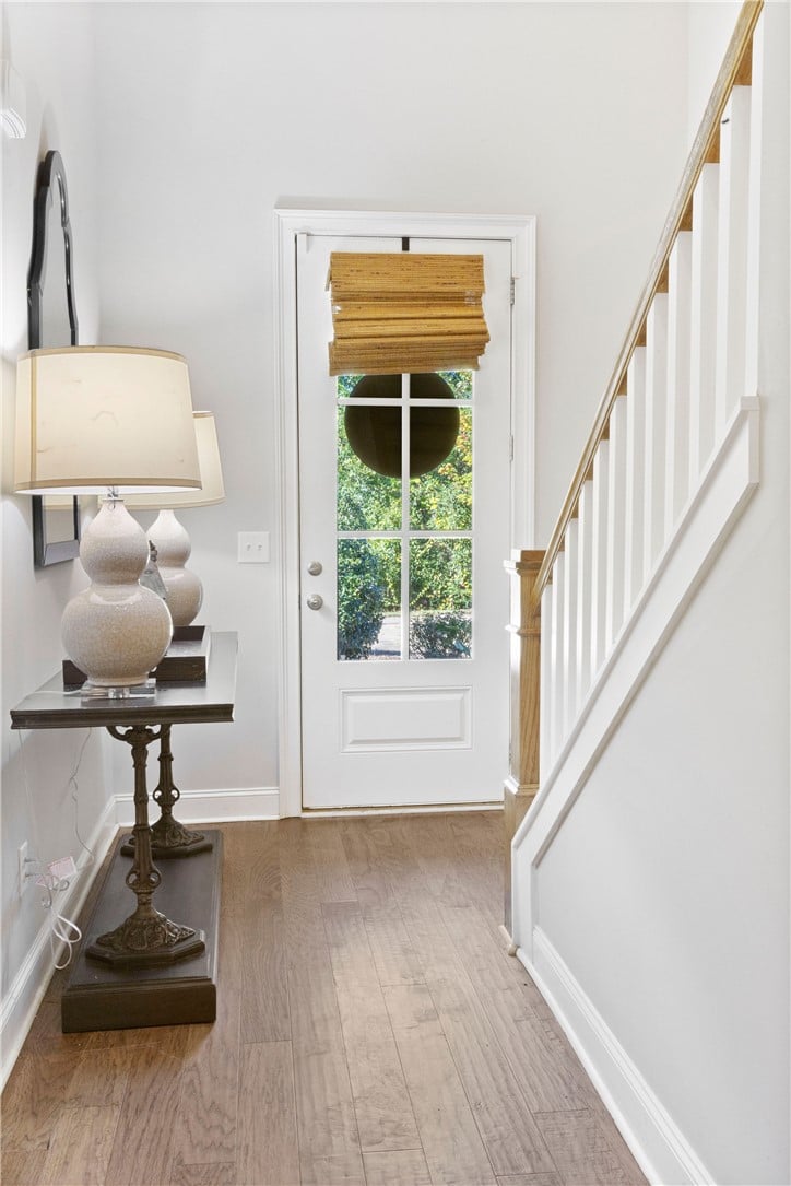1718 W Farmville Rd, Auburn, AL 36830, Hardwood floors and a classic staircase welcome vi