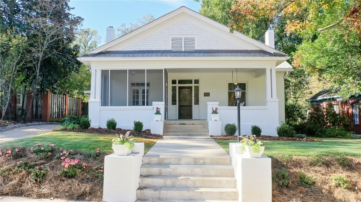 606 N 8th St, Opelika, AL 36801, This charming home offers a welcoming facade with