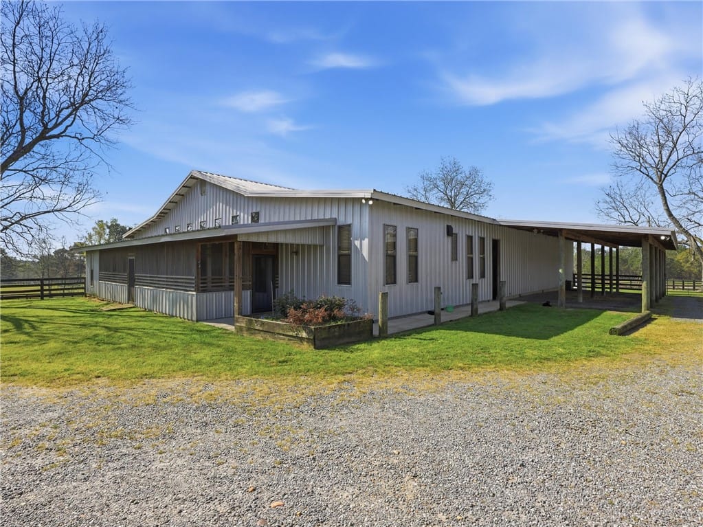 398 Abrams Rd, Tallassee, AL 36078, Metal-sided equestrian facility with an extended c