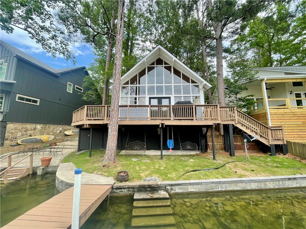242 4th Retreat, Eclectic, AL 36024, A charming lakeside retreat boasts a spacious deck