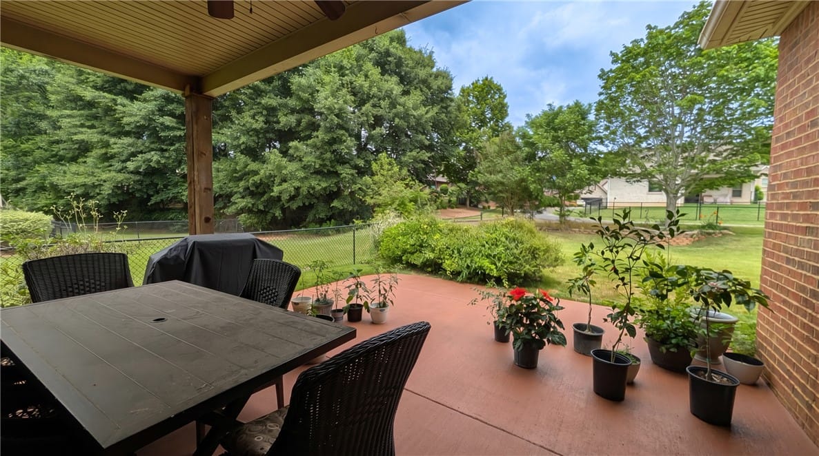 2172 N Donahue Dr, Auburn, AL 36879, Covered back porch opens to an adjacent patio.