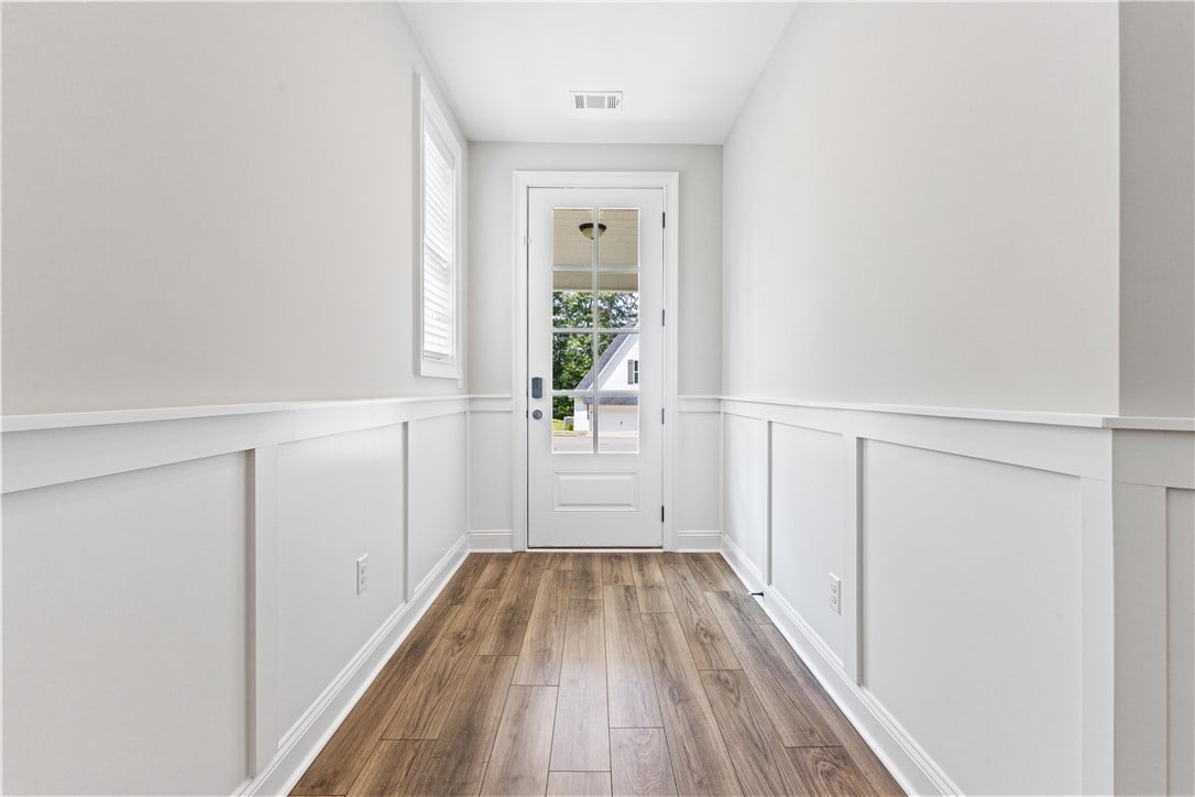 1537 Dartmouth Dr, Auburn, AL 36830, Crisp wainscoting and warm wood-look LVP flooring