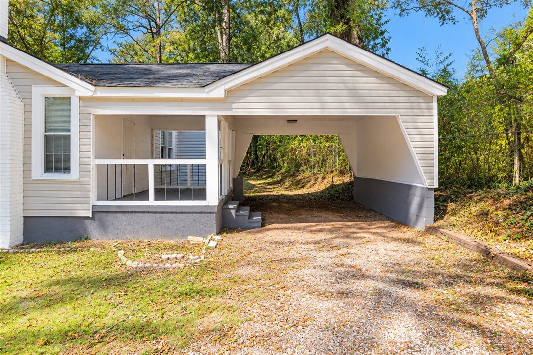 137 Woodland Ave, Valley, AL 36854, A convenient carport is situated alongside a cover