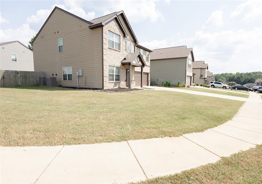 2715 Dunstan Ln, Opelika, AL 36804, A classic brick and siding two-story home, with a