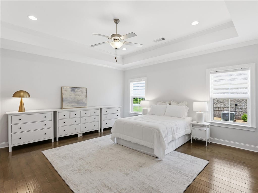 1312 Garrett Ln, Auburn, AL 36830, A tranquil primary bedroom with rich hardwood floo