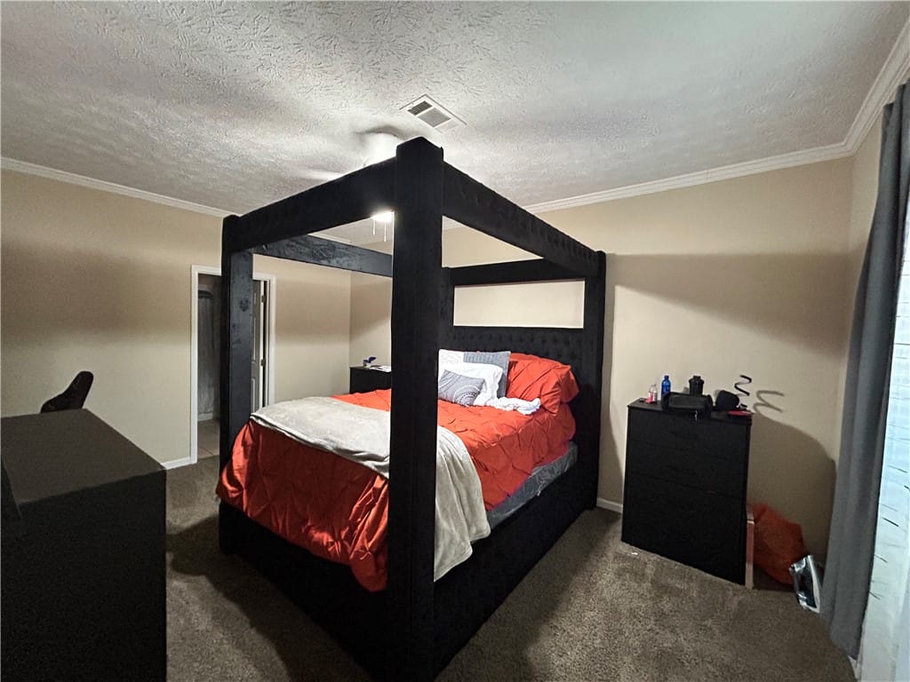 389 Jack Hampton Dr, Auburn, AL 36830, This spacious bedroom offers comfort and ample roo