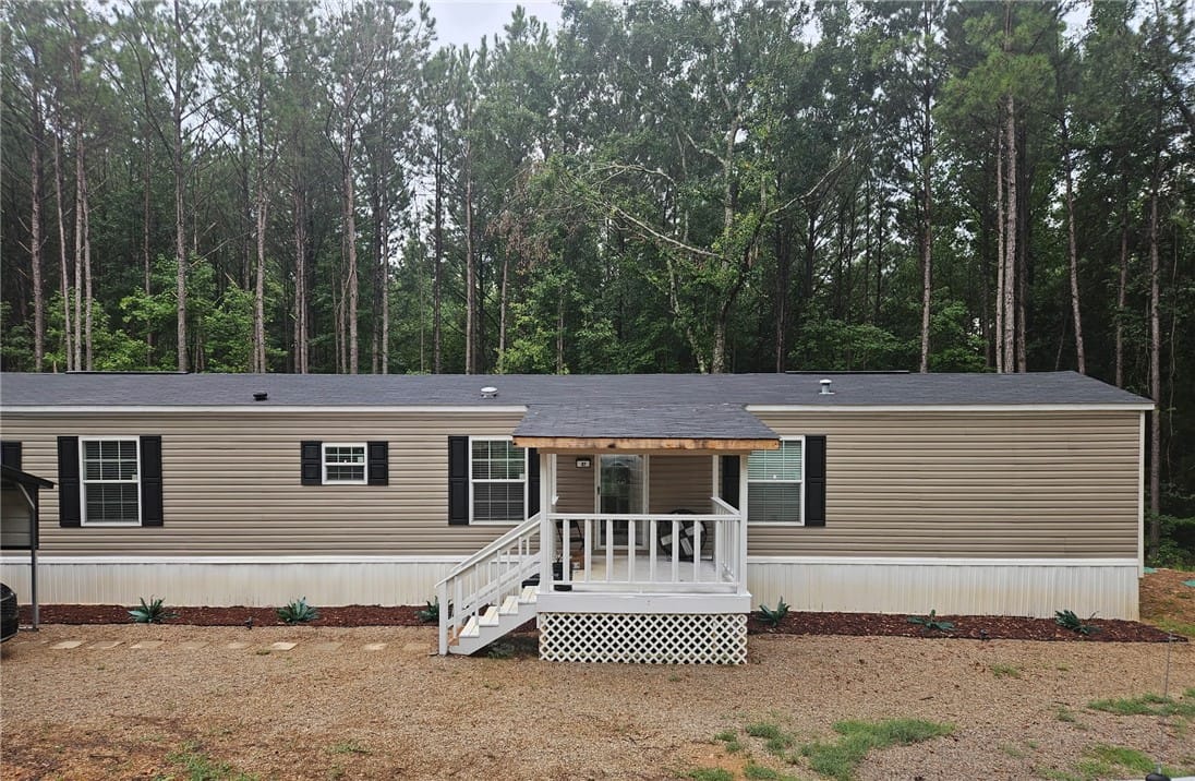 87 Dusty Rd, Tallassee, AL 36078, A welcoming front porch leads to this single-story