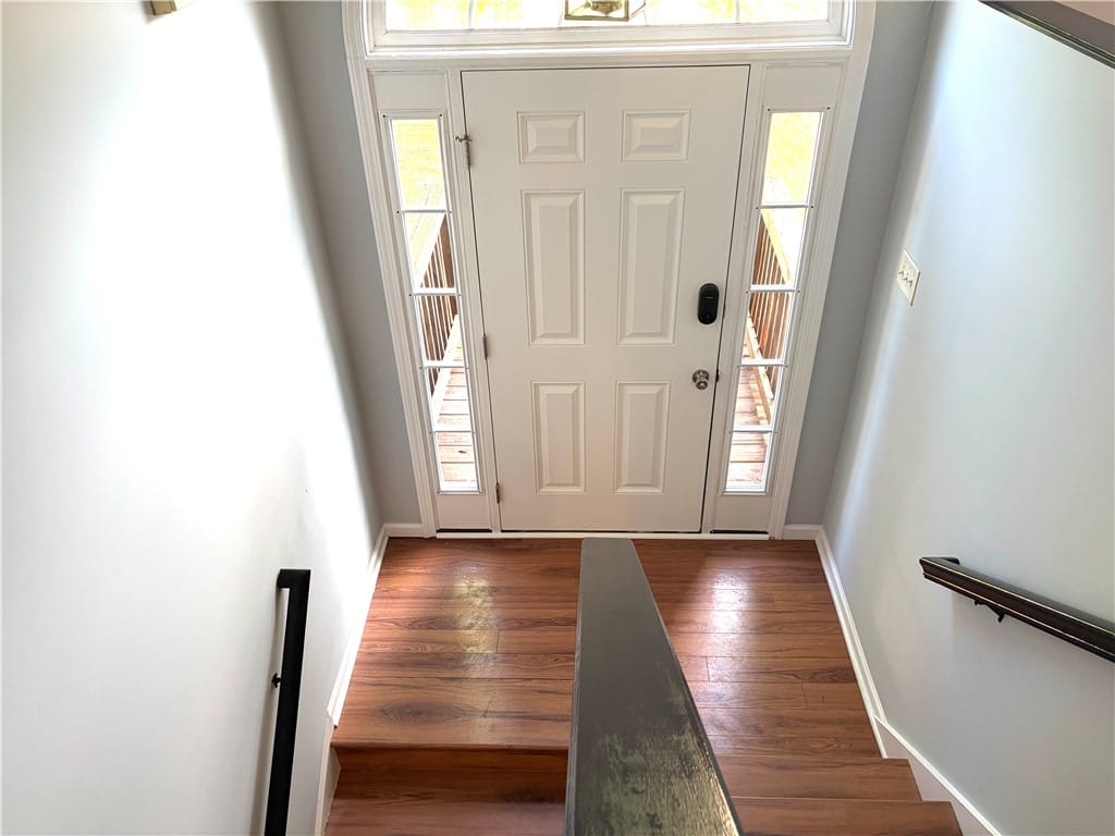 2214 Franklin St, Auburn, AL 36830, A welcoming entryway with rich wood flooring leads