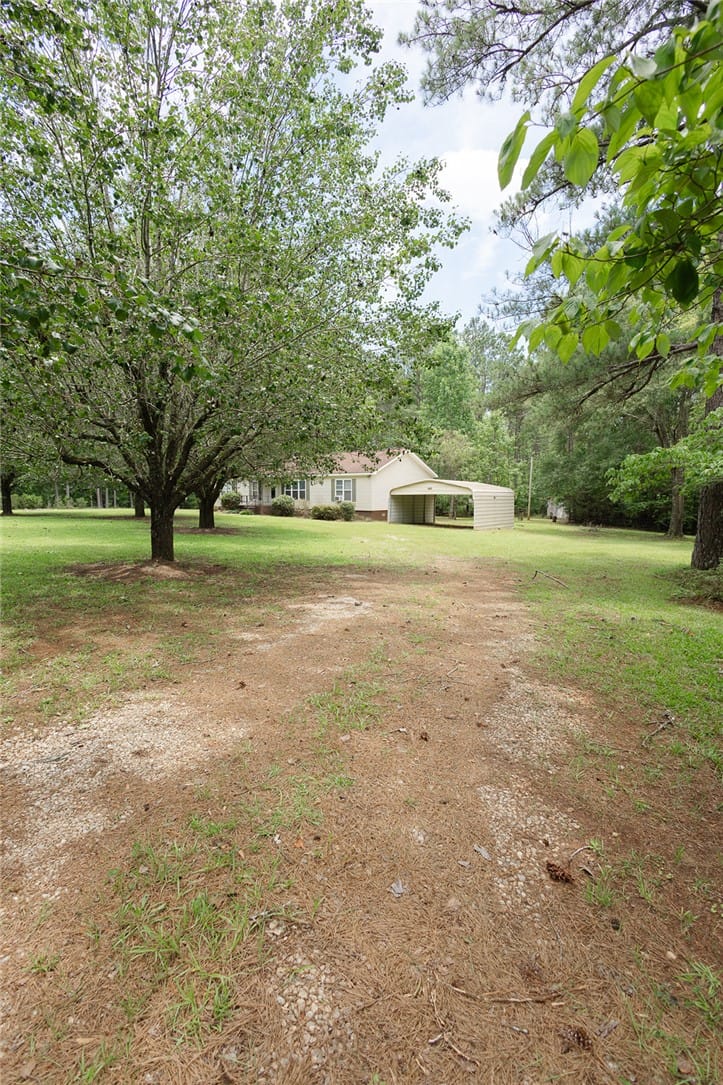3499 Co Rd 388, Valley, AL 36854, A classic ranch home set amidst a spacious yard wi