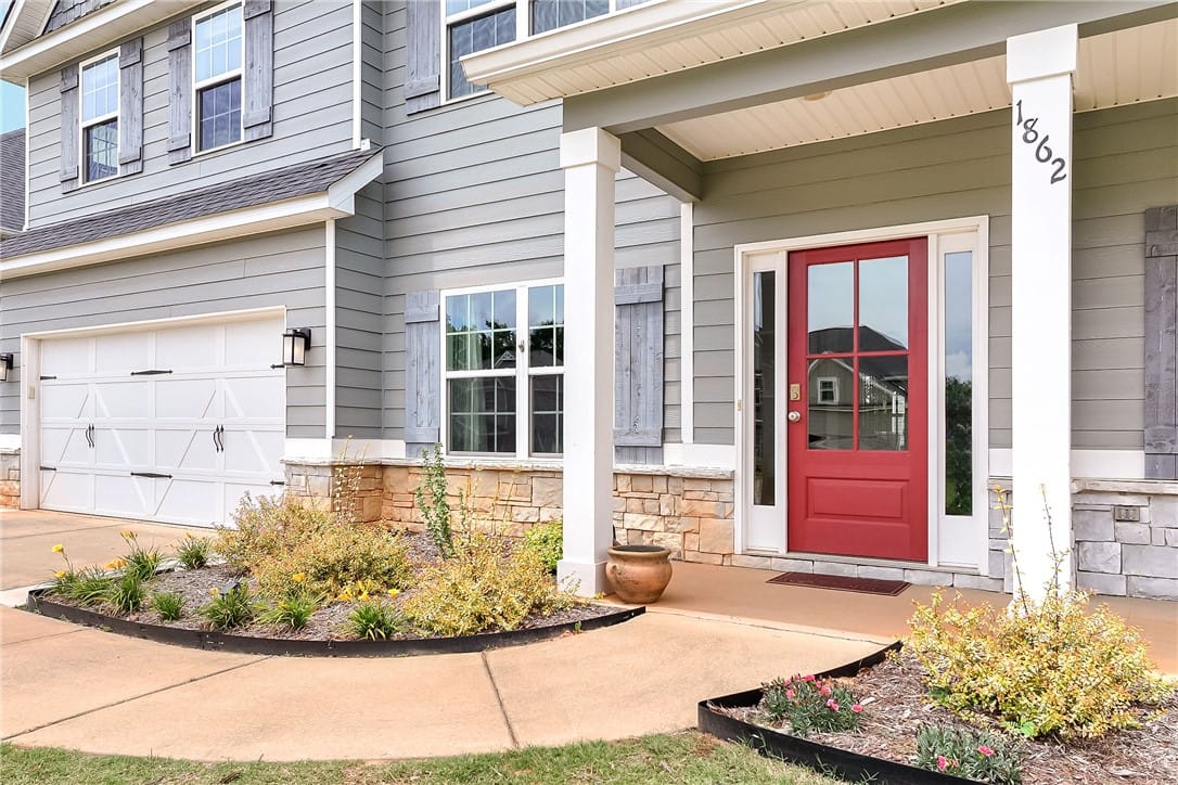 1862 Wildwood Dr, Opelika, AL 36804, A vibrant red entry door beckons, flanked by charm