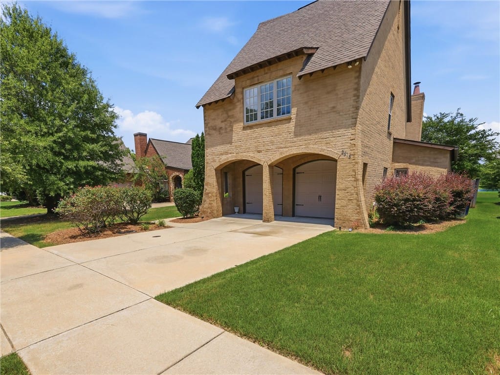2615 Mimms Ln, Auburn, AL 36832, A charming brick exterior with arched garage entri