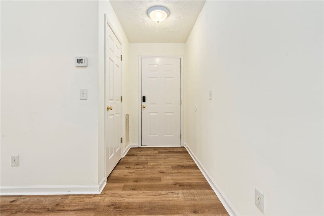 730 W Magnolia Ave #1-304, Auburn, AL 36832, A welcoming entryway features rich hardwood floori
